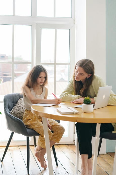 parent working on homework with child